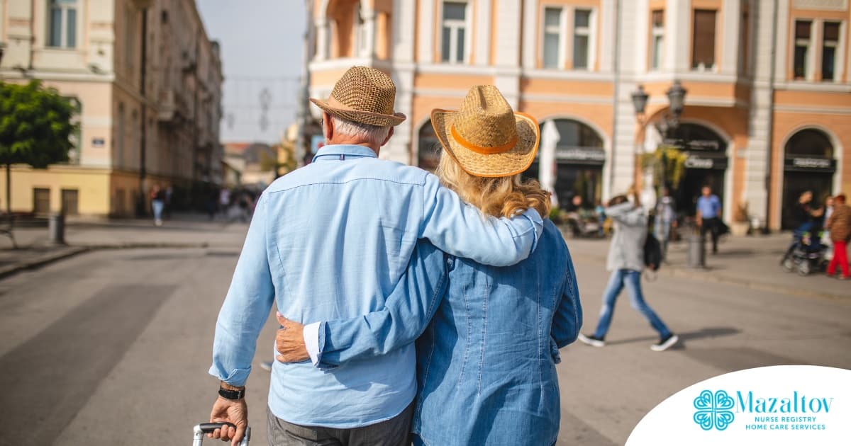 2 older adults hug while on vacation representing the successful outing that can still happen while caring for elderly loved ones.