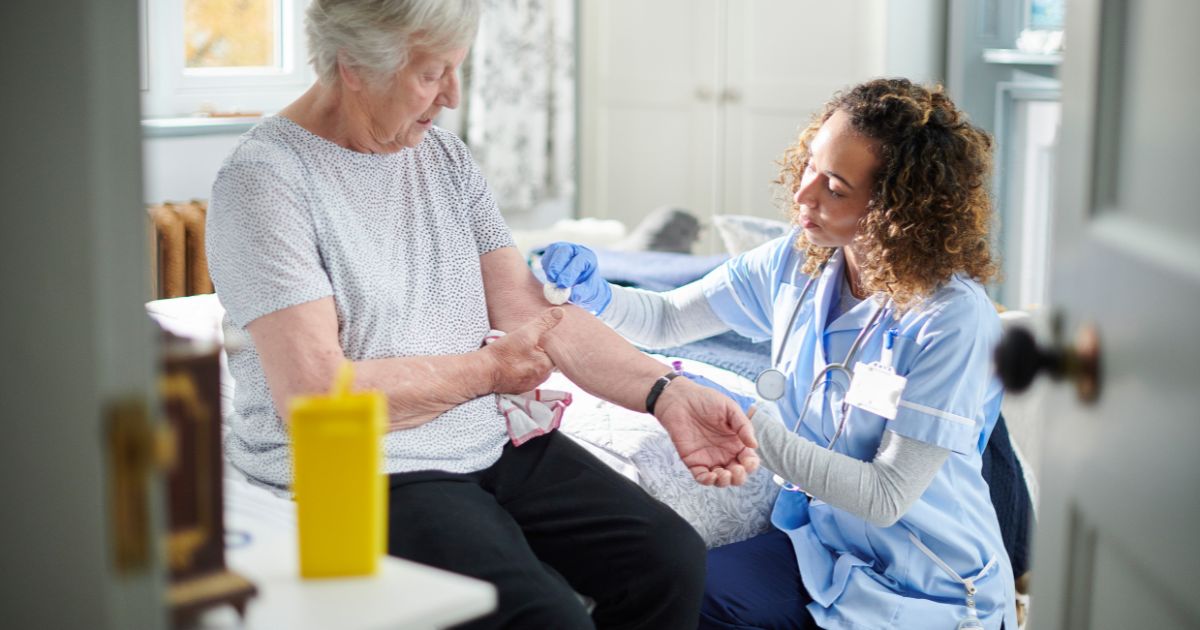 caregiver assisting elderly with diabetes